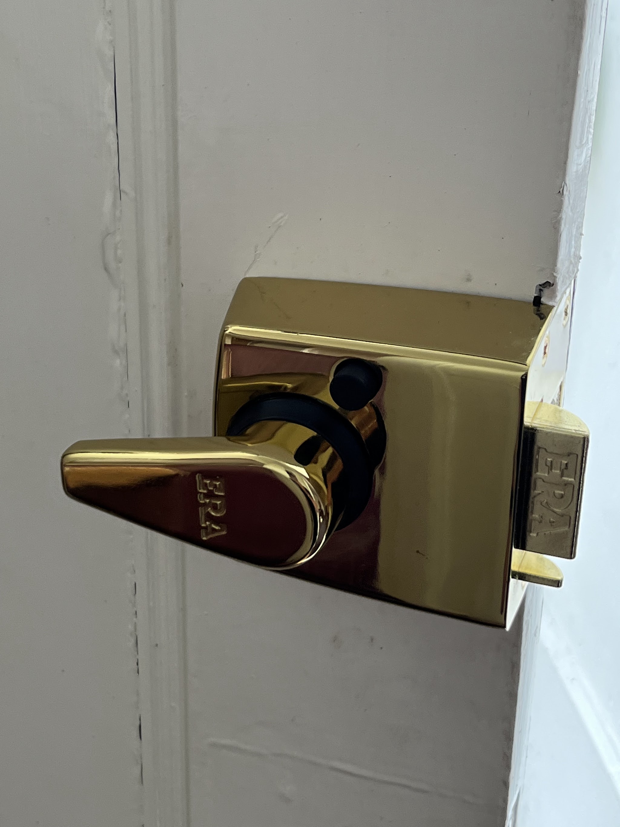 Brass ERA nightlatch newly fitted to a white front door