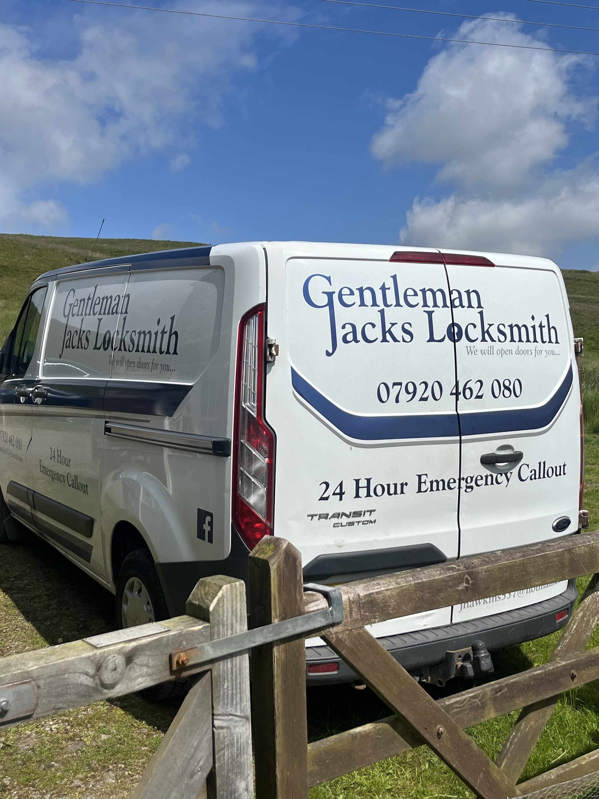 Rear doors of the Gentleman Jacks Locksmith van, reading We will open doors for you, 07920 462 080, 24 Hour Emergency Callout